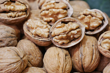 stack of natural walnuts selling at shop 
