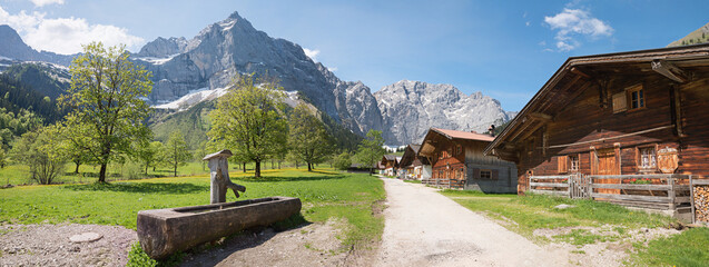 pictorial rural village Eng Almen, tyrolean landscape Karwendel mountains. wooden well, austria