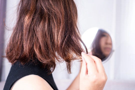 closeup woman have problem with heat damage or dry hair, split ends and hair texture thinning
