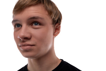 Headshot portrait of a blond teenager young man with short hair