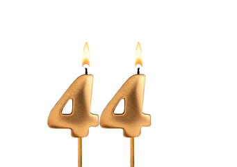 Golden candle number 44 - Birthday on white background