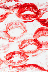 Imprint of red lips on white paper, kiss background