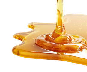 Golden honey dripping isolated on white