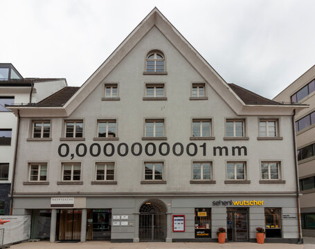 A mural nanometer unit, which equals 0,0000000001 mm, is written in the facade of a traditional Austrian house by Heinz Gappmayr, near the Lake Constance