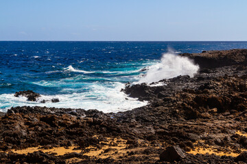 Fototapeta premium Rocky, volcanic Atlantic ocean coast. Charco de Palo region. Lanzarote, Canary Islands, Spain