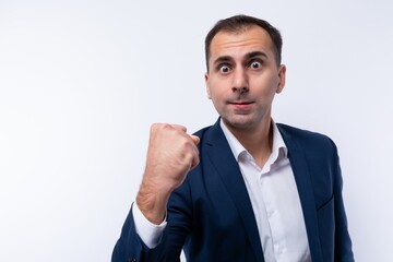 Confident Caucasian man wearing a blue jacket on a white background