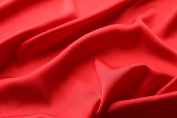 Fototapeta premium Crumpled red silk fabric as background, closeup