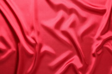 Texture of beautiful red silk fabric as background, closeup
