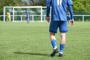 Obraz premium le footballeur sur le terrain