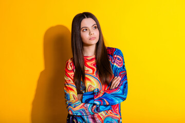 Photo portrait of pretty young girl look empty space crossed hands wear trendy colorful outfit...