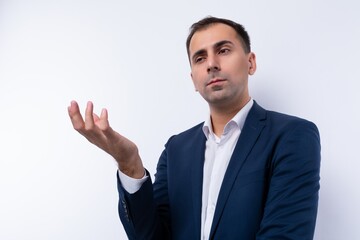 Portrait of a puzzled business man in a blue jacket on a white background
