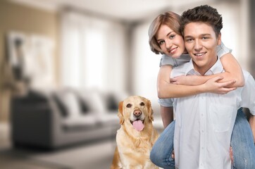 Authentic portrait happy young couple with dog