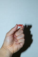 Pill on human hand medical concept