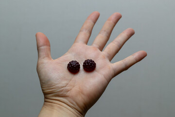 Pill on human hand medical concept