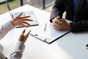 Job interview, The job applicant submits the application documents. Managers read resumes and interview new employees.