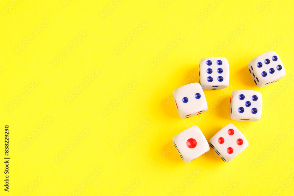 Canvas Prints Many white game dices on yellow background, flat lay. Space for text