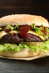 Burger with delicious patty on table, closeup