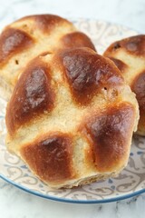 Hot cross buns on white table, closeup