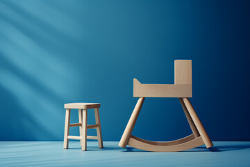 A rocking chair sits in front of a stool
