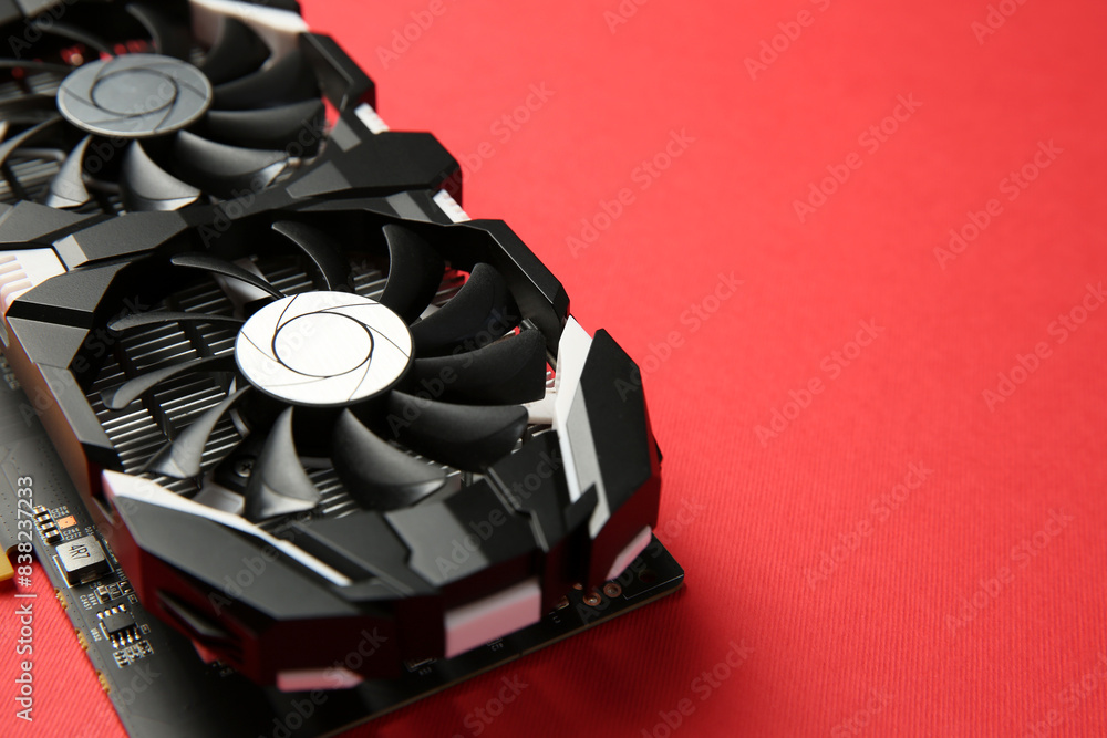 Poster computer graphics card on red background, closeup. space for text