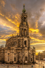 Fototapeta premium Hofkirche Dresden at Sunset with Dramatic Golden Clouds