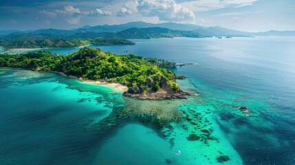 Fototapeta premium Breathtaking aerial view of a serene island in the ocean, featuring lush vegetation and crystal-clear waters