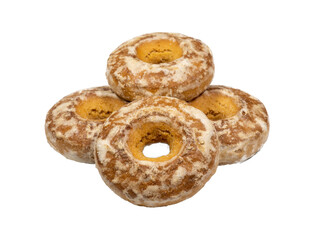 Cookies with icing. Pile of gingerbread cakes with a hole. Bagels on a white background. Sweet confectionery