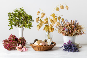 Dried flowers background. Arranging dried flowers into a beautiful bouquet. Sustainable floristry....
