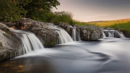 Fototapeta premium The picturesque view of the waterfall conveys all the beauty of nature. The water cascades down the rocky slopes.