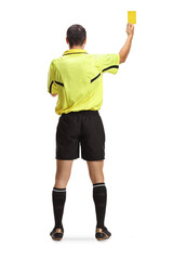 Rear view shot of a football referee showing a yellow card