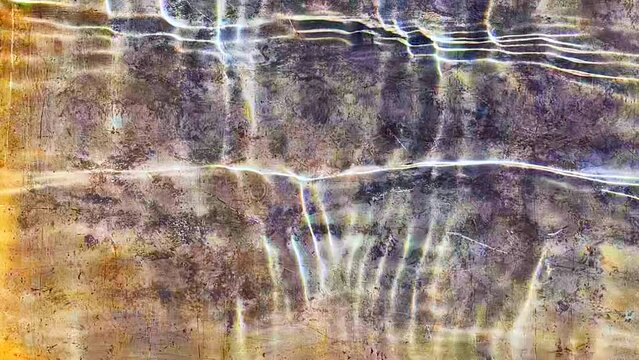 Water in a tray in sunlight, in slow motion, adds-up to incredible beauty.
