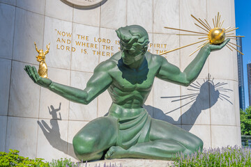 The Spirit of Detroit Sculpture with Sunlit Details and Inspirational Quote