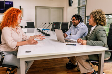 Obraz premium Human resource team talking to a candidate during a job interview in the office.