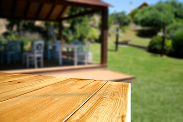 Desk of free space and summer background of garden 