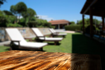 Desk of free space and summer background of garden 