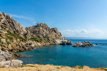 View of a small cove (or cala) on the rocky mediterranean coast in Capo Testa, Sardinia, Italy