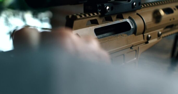 Super slow motion macro of empty bullet shell casing is flying out of machine fire gun during training in a shooting range. Shooting and Weapons