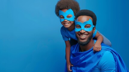 Festive Father's Day celebration with African American father and son in superhero masks and blue outfits