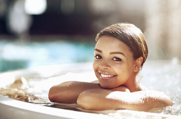 Woman, spa and relax by hot tub for holiday, portrait and rest for vacation at resort for salon...
