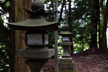 Old Stone lanterns at Japanese old shrine at the countryside close up