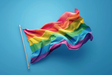 Fototapeta premium Flowing rainbow flag on a blue background symbolizing LGBTQ pride and fluidity in a vibrant and dynamic digital illustration