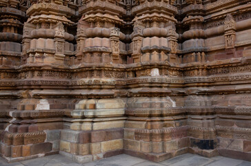 Intricate designs and sculptures on the wall of Kandariya Mahadeva Temple in the Khajuraho temple...