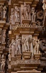 Ancient sculptures designed on the wall of Kandariya Mahadeva Temple in the Khajuraho temple complex, India