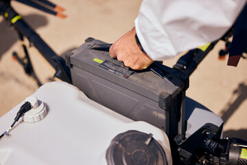 Photo of a process of replacement of the agrodrone battery.