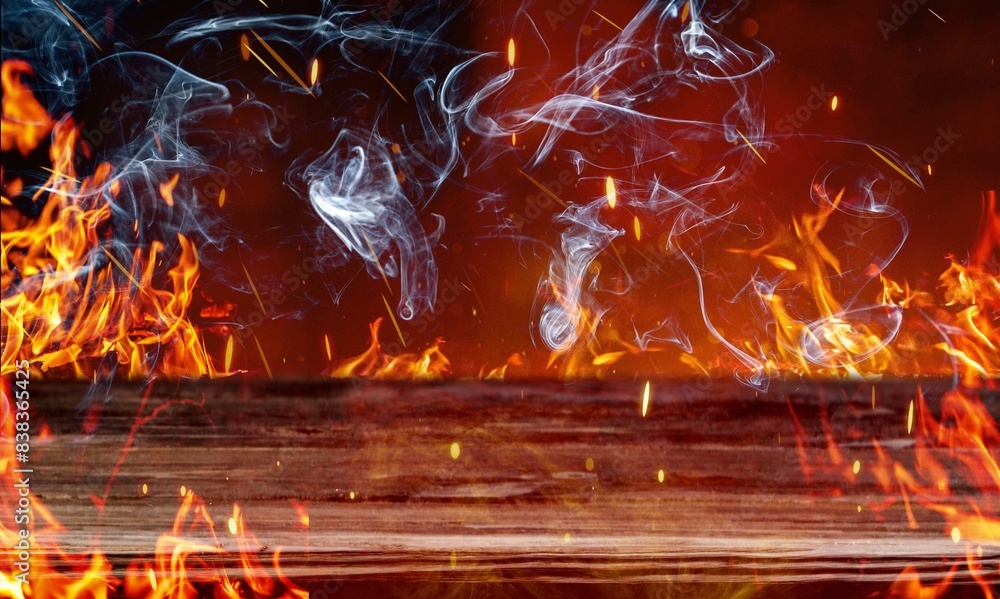 Poster Wooden table with bright fire sparks and smoke