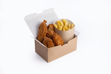 Fried chicken and fries in a box.