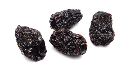 Black dried jujube on white background.