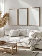 Three poster or photography frame mockup on the white wall in a Boho style interior with sofa and other furniture decor