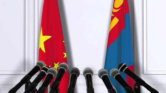 Mongolia and China National Flags with Microphones. Official Press Conference of Countries Government