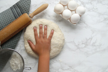 Handmade Dough With a Small Child's Hand